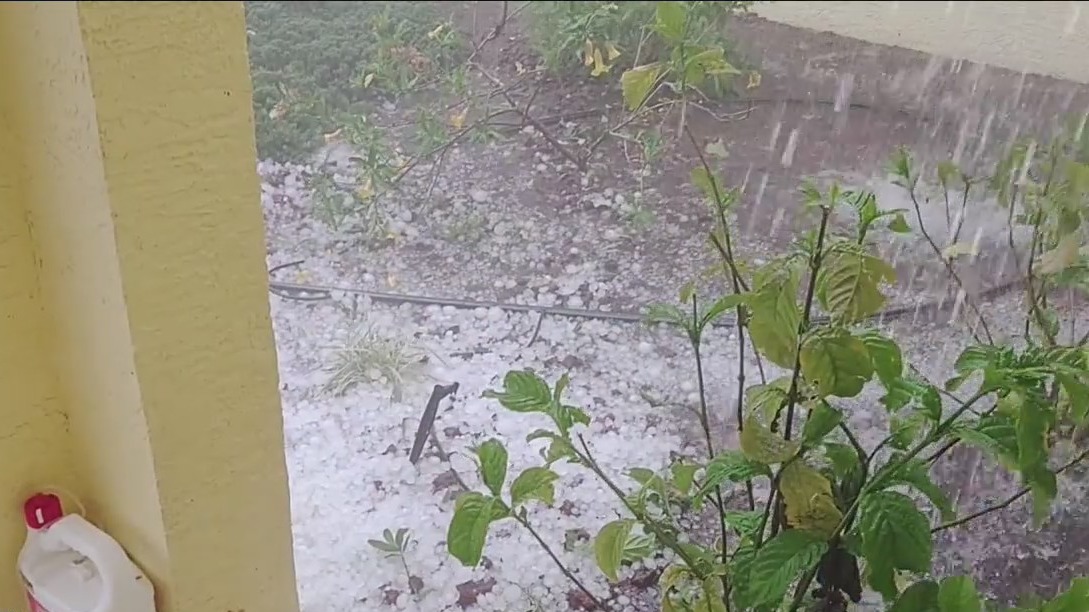 Residents clean up after hail falls during storms in Highlands County